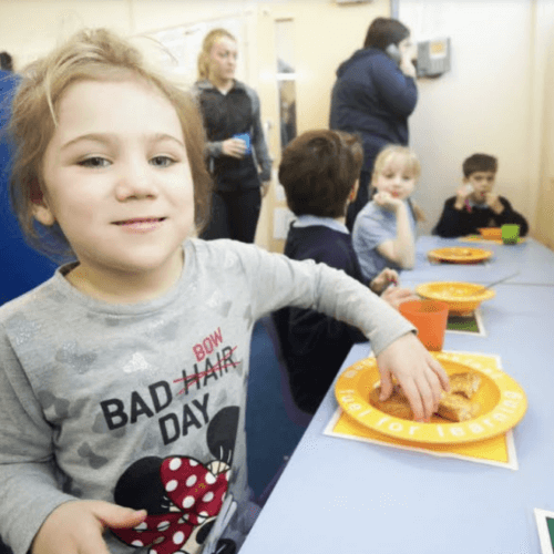 child eating breakfast at magic breakfast club