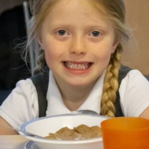 Funding a better start - Cover image of a child having breakfast
