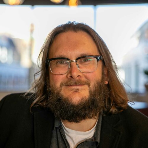 A headshot of Alan Mustafa, Head of People and Culture
