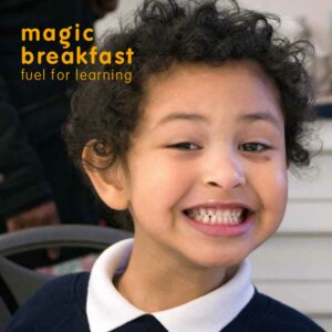 A picture of a smiling child for the Annual report 2021-2022