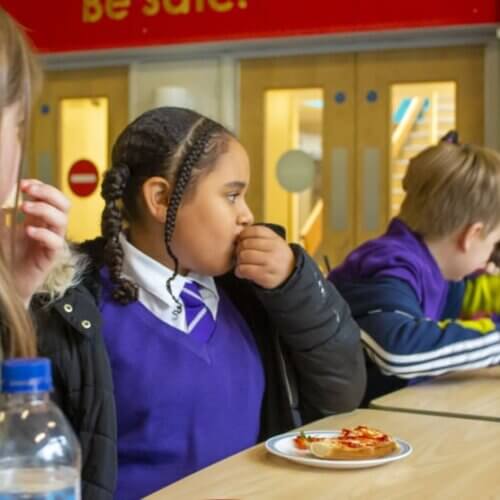 Children eat food at school
