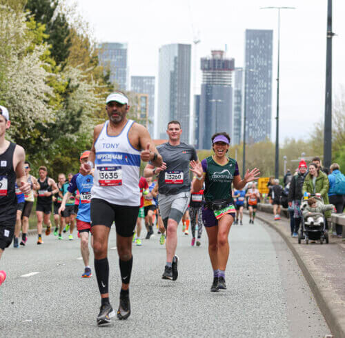 Image of individuals running a race