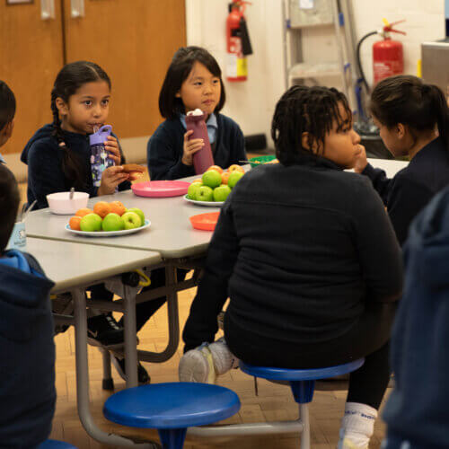 A picture of children eating breakfast