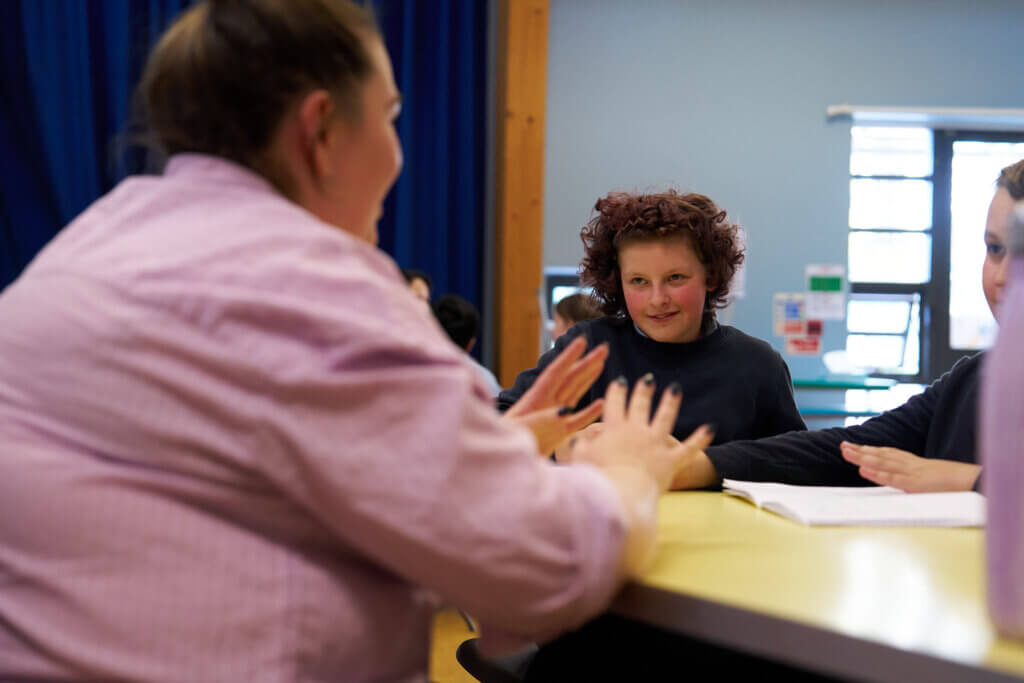 Image of children and young people talking to a partner staff member at a Magic Breakfast Aspiration Day.