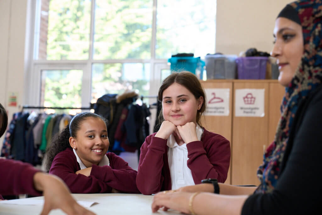 Image of children and young people talking to a partner staff member at a Magic Breakfast Aspiration Day.