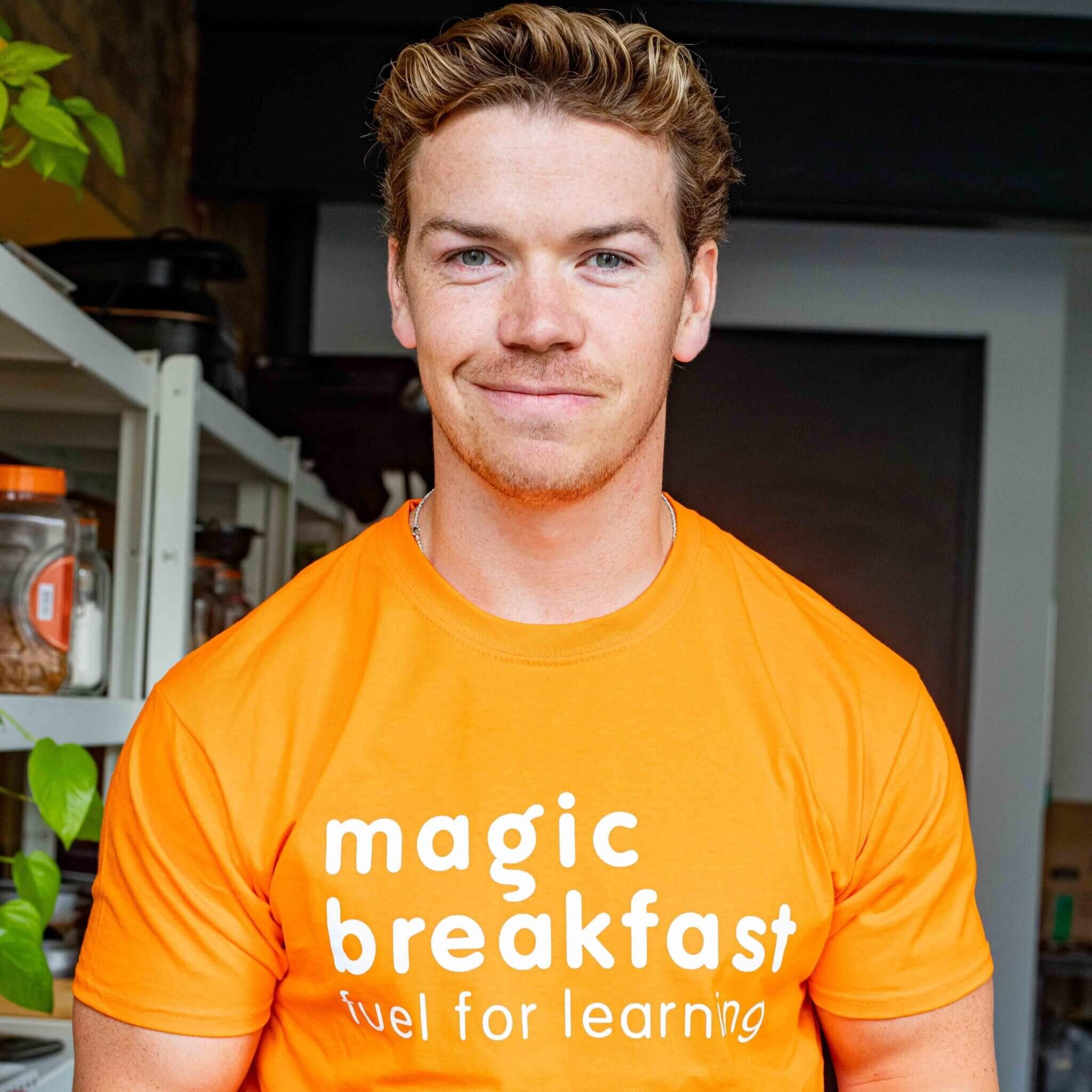 Will Poulter wearing the Magic Breakfast T-shirt